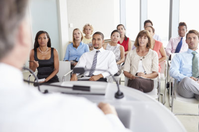 group of people sitting while listening